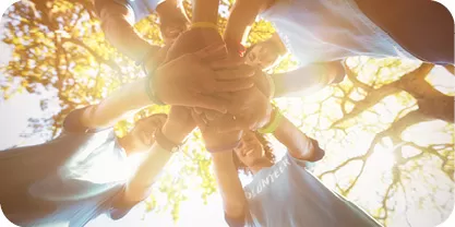 Group of people holding hands
