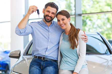 couple showing off car key